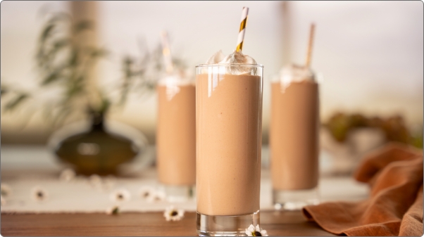 Trish's peanut butter chocolate banana smoothie with whipped cream on top Trish's peanut butter chocolate banana smoothie with whipped cream on top
